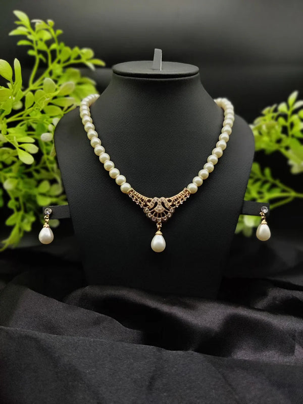 Regal Pearl Embrace Necklace Set With Elegant Drop Design